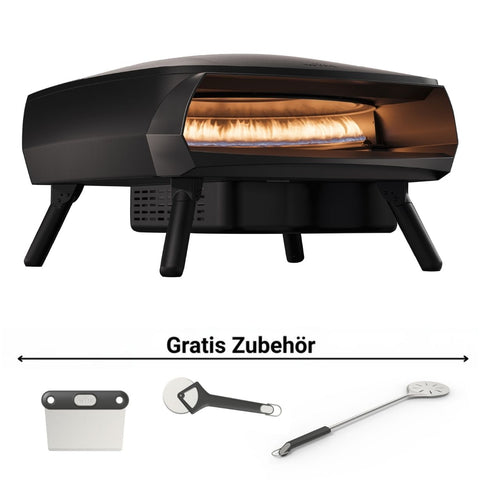 Der Witt ETNA FERMO Gas Pizzaofen von Witt in schwarz, perfekt für neapolitanische Pizzen mit sichtbarer Flamme und vier Beinen. Inklusive drei kostenloser Zubehörteile: Pizzaschieber, Cutter und Wendeschieber, alle unter "Gratis Zubehör" abgebildet.