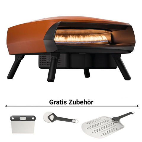 Der Witt ETNA ROTANTE Gas Pizzaofen mit rotierendem Stein in Orange wird mit einer Pizza im Inneren gezeigt. Unten sind Bilder von einem Pizzaschneider, Drehschaufel und Servierschaufel. Text: "Gratis Zubehör".