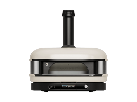 Der Gozney Dome Gen 2 XL Pizzaofen - Hybrid Brennstoffsystem von Gozney verfügt über ein beigefarbenes, modernes Design, ein Glasfenster an der Vorderseite, einen schwarzen Schornstein und eine digitale Steuerung für perfekte hausgemachte Pizzen.