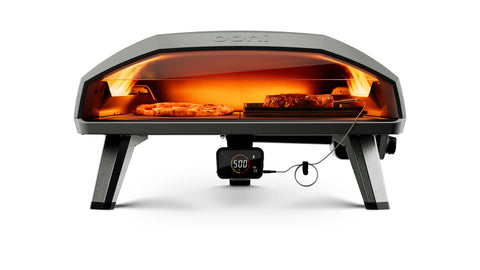 Un four d'extérieur au design élancé, parfait pour la cuisson de pizzas et de grosses pièces de viande. Le four à pizza à gaz Ooni Koda 2 Max - 61 cm d'Ooni dispose de commandes numériques et d'un thermomètre pouvant atteindre 500 degrés Fahrenheit. Son intérieur bien éclairé présente la nourriture à l'intérieur et en fait un complément idéal pour votre cuisine de jardin.